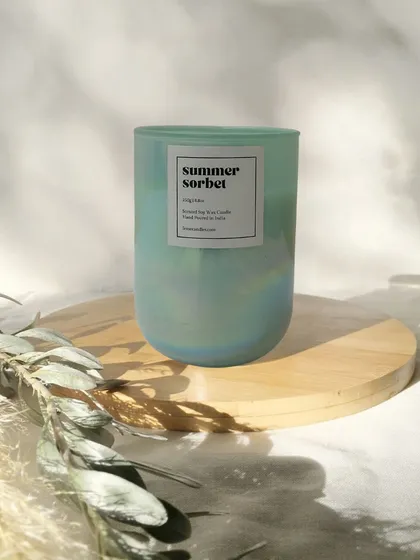 Our Summer Sorbet candle, housed in a beautiful green holographic jar. It's a limited edition fragrance perfect for the sunny season.