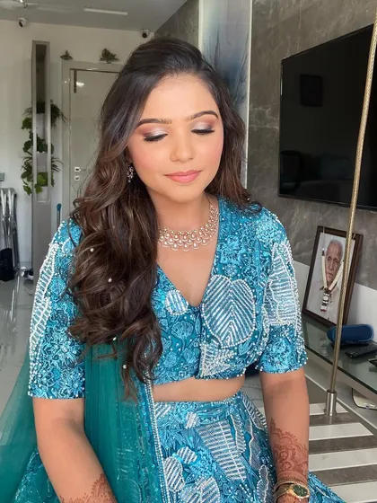 Glass skin with a subtle yet glam eye for my gorgeous bride Mansi. This look in her blue lehenga is perfect for an engagement or Mehendi party.