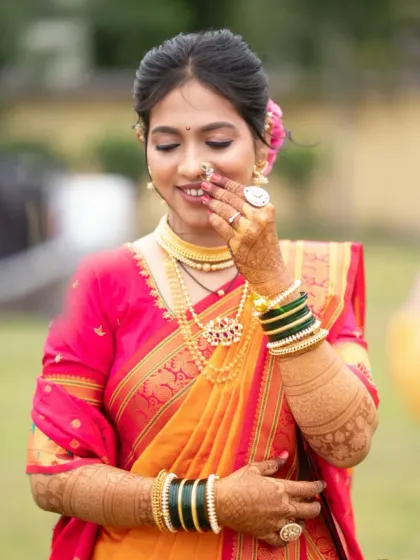 A shy, happy smile. This candid shot captures the essence of a bride's joy on her special day.