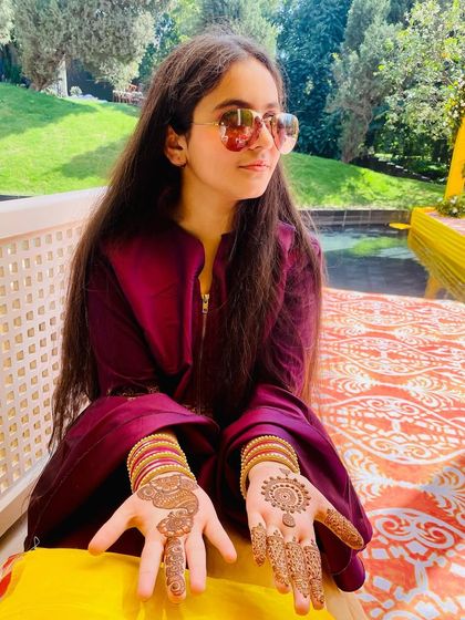 Another shot of the young client enjoying her festive mehndi. This shows that I can create age-appropriate and beautiful designs for everyone in the family.