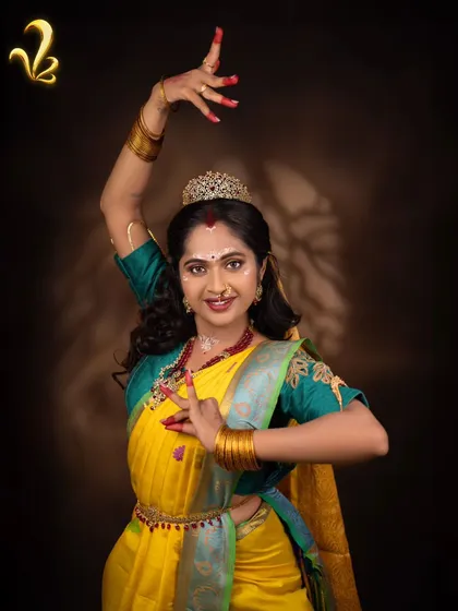 A graceful dance pose as Chandrakantha. This captures her dual nature of fierceness and grace, showing that power can be expressed through both strength and artistry.
