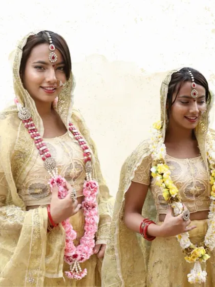 Here, you can see two different styles of my fabric varmalas. One features delicate pink roses, while the other has cheerful yellow flowers, showing the versatility of my custom designs.