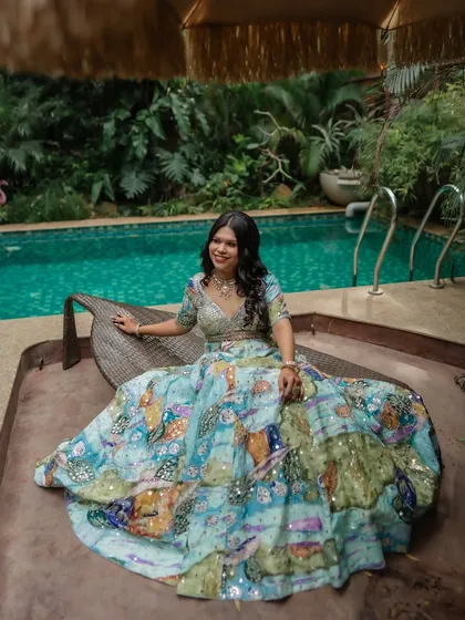 A relaxed and happy shot by the pool. The makeup is light and summery, perfect for a daytime event in a beautiful resort setting.