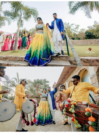 The couple's grand entrance to their Mehendi, accompanied by dhol players. The bride's colorful rainbow lehenga is a standout detail that we made sure to feature.