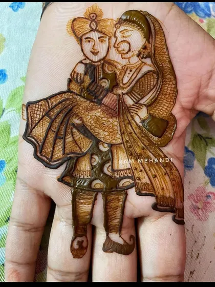 A romantic portrait of the groom carrying his bride. I specialize in capturing these moments with fine lines and shading to bring the figures to life. This kind of personalized portrait mehndi makes your design truly one of a kind.