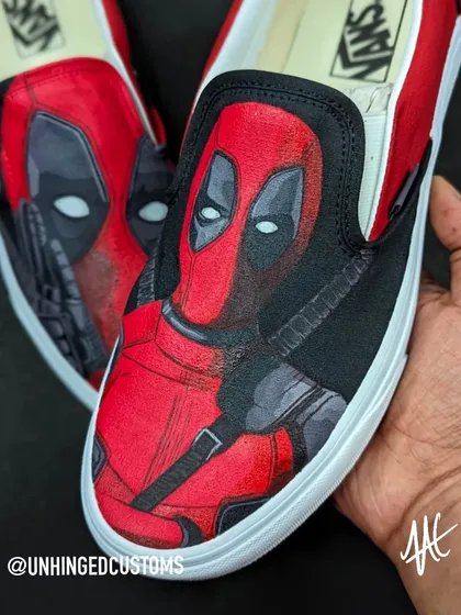 A detailed close-up of Deadpool's portrait on the Vans. Getting the texture and shading right was key to this design.