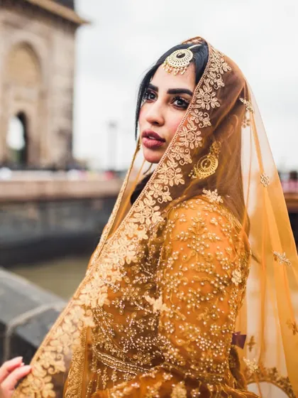 A portrait that feels both powerful and serene. Using the iconic Gateway of India as a backdrop, I focused on the intricate details of her traditional attire and her graceful presence. This is a great example of a styled individual portrait session.
