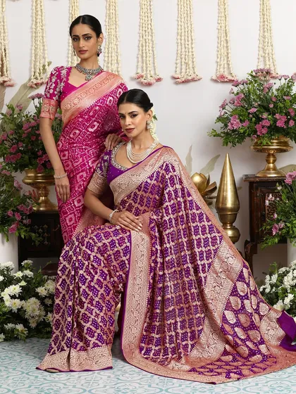 A repeat of the stunning image of two models in our rani pink and royal purple Bandhani sarees.