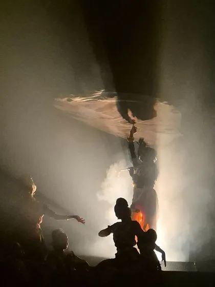 We believe in creating a complete sensory experience. This silhouette from "KRISHNA" showcases our use of atmospheric smoke and backlighting to build suspense and evoke a sense of the mystical, making the performance unforgettable.