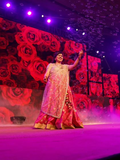 A beautiful solo moment on stage. The right lighting, costume, and expression can make any performance magical.