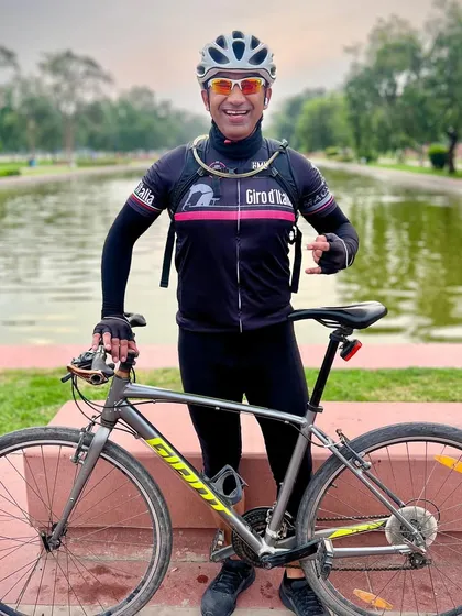 A member posing with his Giant bike by the water at India Gate. The scenic backdrops make for stunning photos.