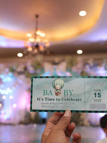 A custom-designed ticket for the baby shower, adding to the event's unique theme and making guests feel like they have a pass to a very special celebration.