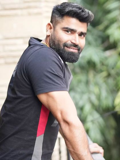 A relaxed, candid photo. My coaching style is not just about serious training; it's also about finding joy and ease in the process.