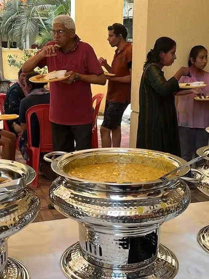 Guests enjoying our food at a daytime Holi party. My buffet service is perfect for any celebration, big or small, ensuring everyone gets to eat hot and tasty food together.