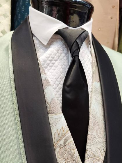 A collection of our designer suits, showcasing a variety of colors, fabrics, and custom details like embroidery, unique lapels, and accessories. Each piece is crafted to make a lasting impression.