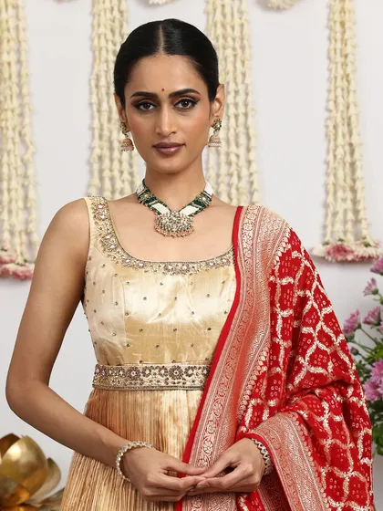 Another view of the gold blouse, showing its versatility and how it can be paired with different dupattas and jewelry.