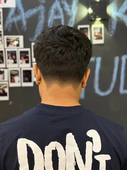 The view from the back, highlighting the clean V-shape taper at the neckline. It's these details that make a haircut last and look great as it grows out.