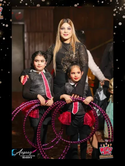 Two of our talented hula hoop performers posing with their instructor before their big moment at Aagaaz.