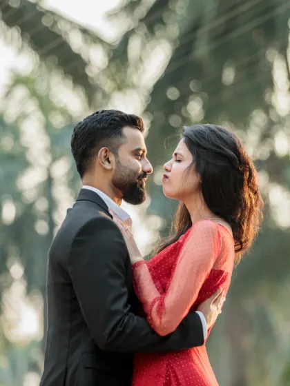 A playful and intimate close-up. The couple's expressions show their fun-loving chemistry and deep affection for each other.