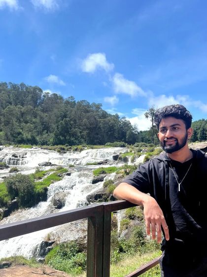 Posing in front of the beautiful Pykara Falls. Ooty is full of stunning natural spots like this.