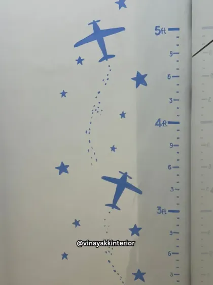 Functionality is key, even in a themed room. This custom height chart with airplane motifs allows parents to track their child's growth while perfectly matching the room's adventurous decor.