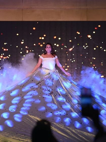A spectacular moment using a large fabric prop to create a dramatic effect. This is how you make an entrance.