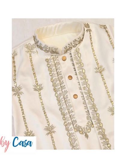 The intricate embroidery on the collar and placket of our festive kurta. We believe in perfecting every detail to create an outfit that is truly special.