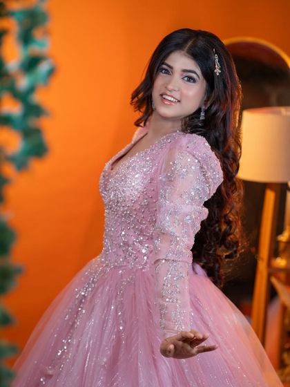 This pose shows off the puff sleeves of the gown and the soft waves in her hair.