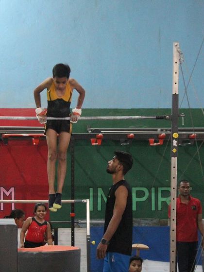A collection of photos and videos showing our gymnasts training on various artistic apparatuses, including the balance beam, bars, and floor.