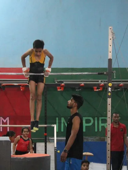 A collection of photos and videos showing our gymnasts training on various artistic apparatuses, including the balance beam, bars, and floor.