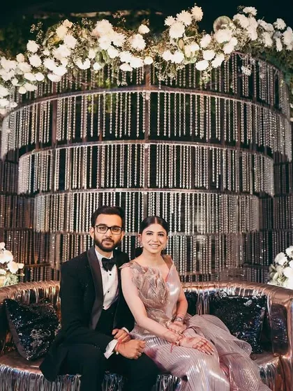 Shikha and her partner at their glamorous cocktail event in Raipur. Her metallic Amit Aggarwal gown was paired with a sophisticated updo and a soft smoky eye.