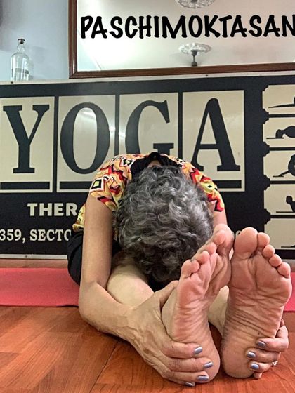 Paschimottanasana, the seated forward bend. This is a fundamental yoga posture for stretching the entire back body, from the heels to the neck.