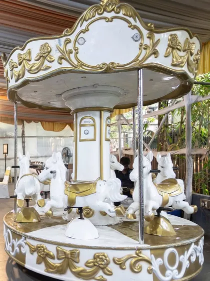 A classic white and gold carousel provided timeless fun and a stunning visual element at the mermaid-themed celebration.