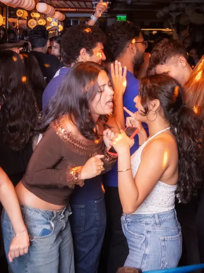 Guests singing along to their favorite throwback anthems at Monkey Bar. The nostalgia is real.