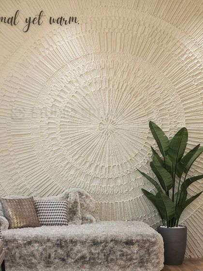 A close-up of the "Minimal yet warm" textured wall art, showcasing the intricate, handcrafted detail that adds a unique, personal touch to the room.