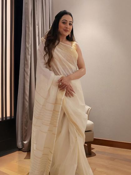 Another beautiful South Indian look for an event in Kochi. The classic white and gold saree with jasmine flowers in my hair was a perfect nod to the local traditions.