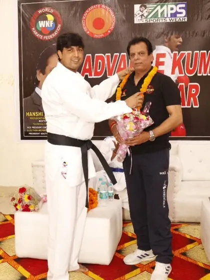 We believe in learning from the best. I am seen here honoring the legendary Hanshi Bharat Sharma during an advanced kumite seminar hosted for our students.