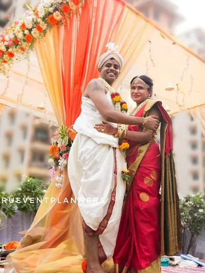 A heartfelt embrace under the mandap, surrounded by vibrant decorations. Capturing the core moments of the wedding ceremony is essential. We make sure to document these significant rituals and the emotions that come with them, preserving the sanctity and joy of the event.