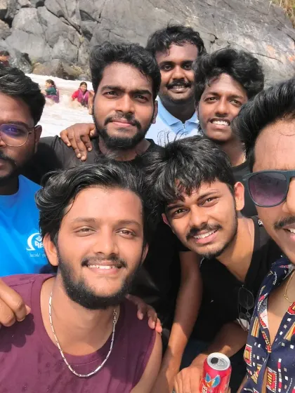 A happy group selfie on the beach. Our Gokarna trips are perfect for making new friends and enjoying a laid-back weekend.