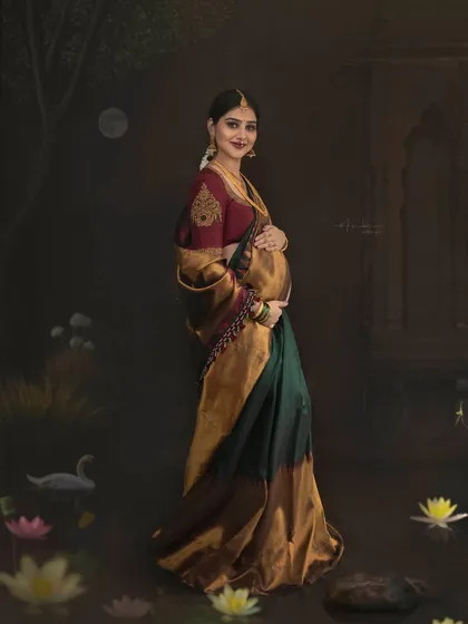 A standing portrait that captures the full splendor of the Kanjeevaram saree against the artistic backdrop. The composition is carefully balanced to create a sense of grandeur and timelessness.