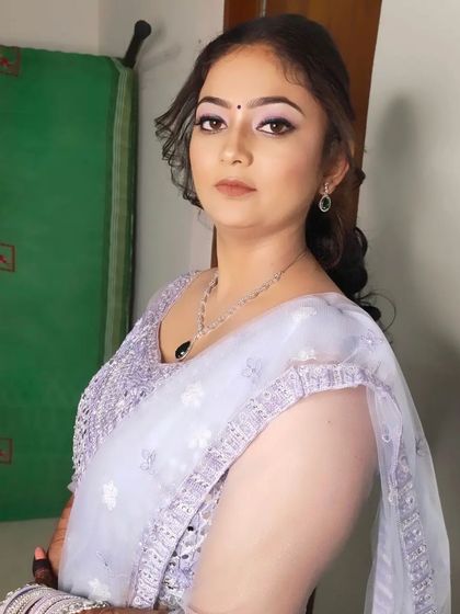 A portrait of the bride, looking elegant and ready for her sangeet night. The makeup enhances her features without overpowering them.