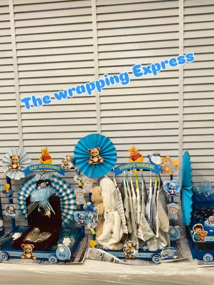 My 'Big Brother Express' train is a very popular gift for welcoming a new baby. This large, multi-cart setup includes separate sections for clothes, toys, accessories, and even a special silver gift set.