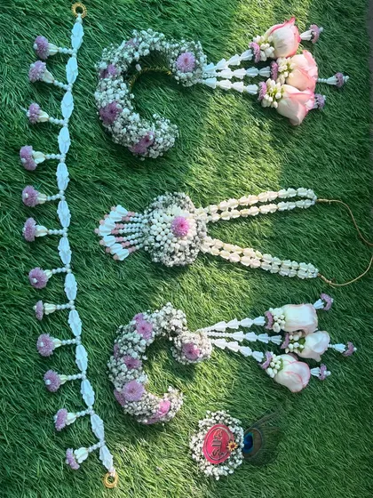 Another view of the fresh floral jewellery pieces, showing the intricate work with baby's breath and pink roses.