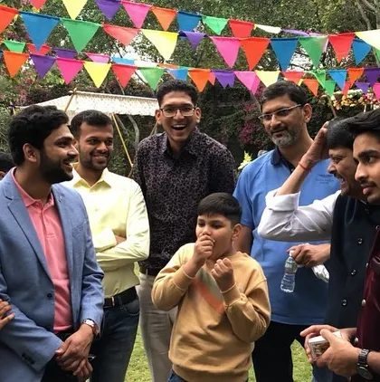 A fun moment with a group of guests at an outdoor wedding function. I love performing for people of all ages, bringing everyone together for a shared experience of magic.
