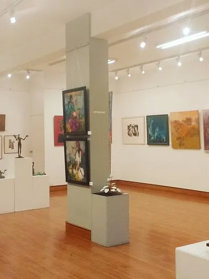 A wider perspective of our gallery during a group exhibition. The clean, well-lit space is designed to ensure every artwork, from large canvases to intricate sculptures, is presented without distraction, allowing the art itself to be the focus.