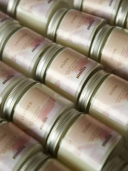 The warm glow of the custom candles, ready to be gifted.