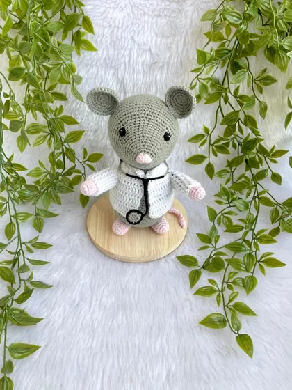 Dr. Mouse! This was a custom order for a graduation gift. The mouse is dressed in a doctor's apron with a tiny stethoscope and comes on a wooden base to be a display piece.