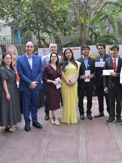 A group photo of the MUN participants with the esteemed jury and organizers. The event is a collaborative success, bringing together students, teachers, and diplomatic guests.