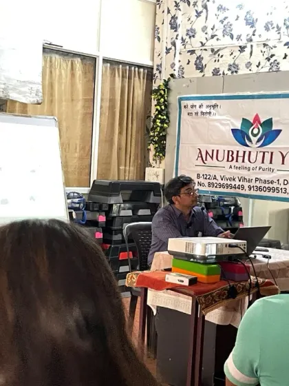 An attendee's perspective during the Heart Wellness workshop with Dr. Lalit Gupta. We use visual aids and presentations to make complex medical information easy to understand.