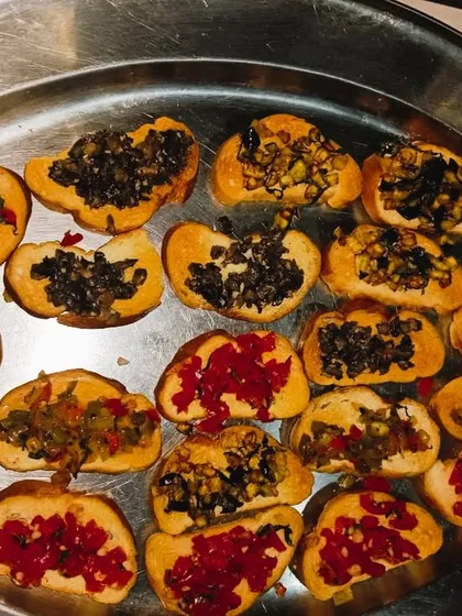 A close-up of our delicious bruschetta appetizers, perfect for corporate events and parties. We focus on fresh ingredients and beautiful presentation to impress your guests from the start.